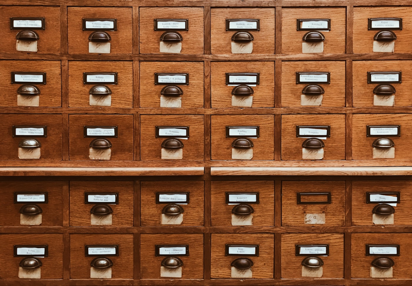 A library card catalog of wooden drawers, a metaphor for a JSON inventory built over a document corpus