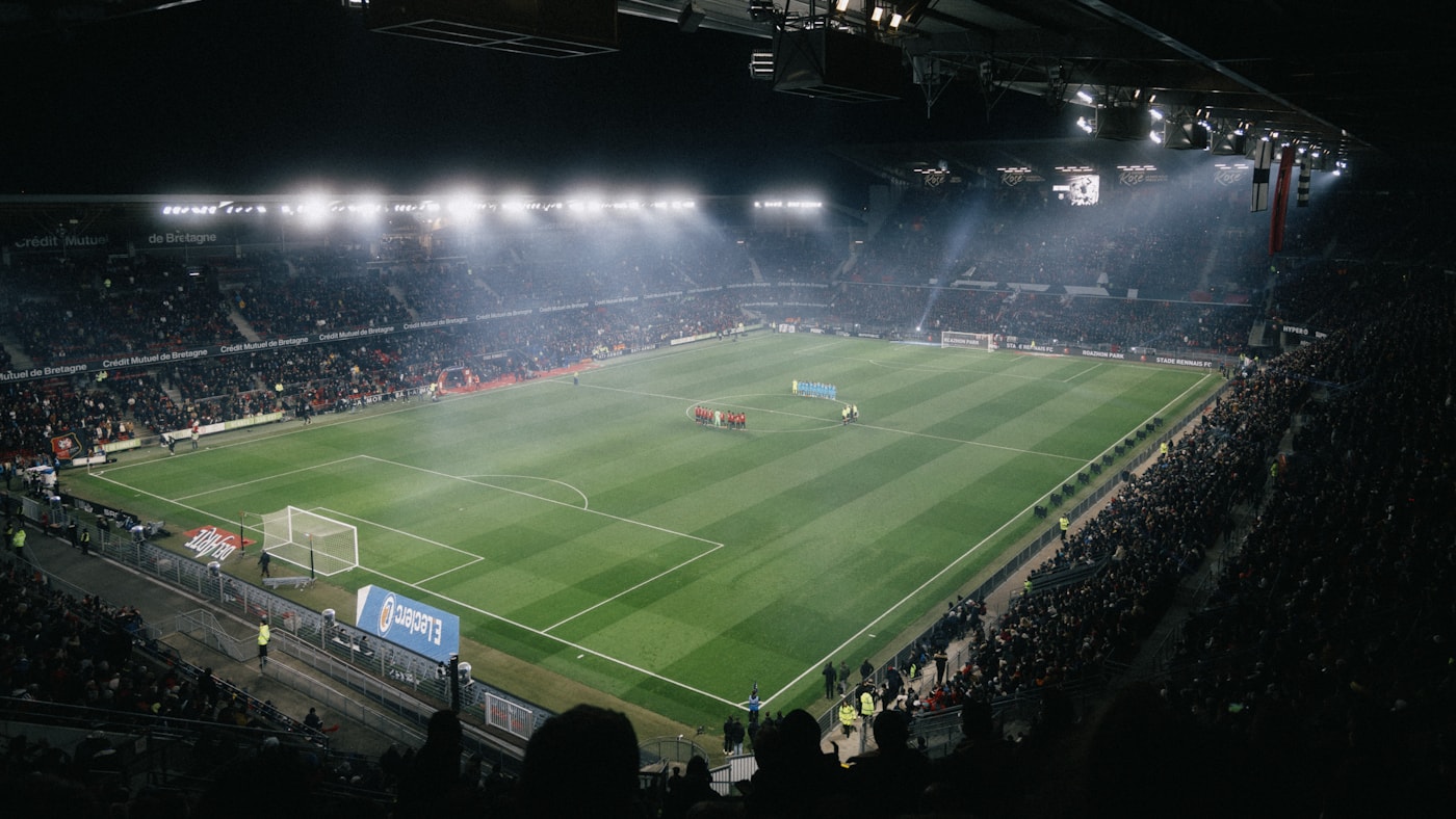 A floodlit stadium mid-match, the kind of raw footage a video-native model turns into a timestamped event timeline instead of a caption