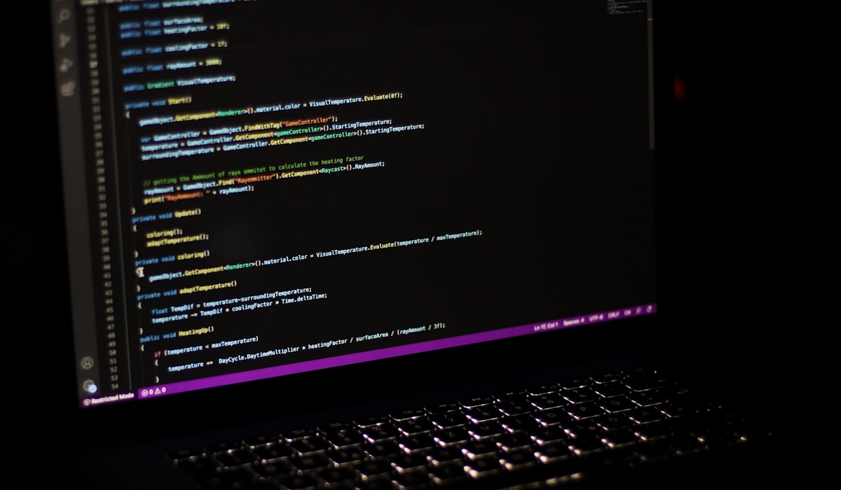 Laptop screen showing Python code