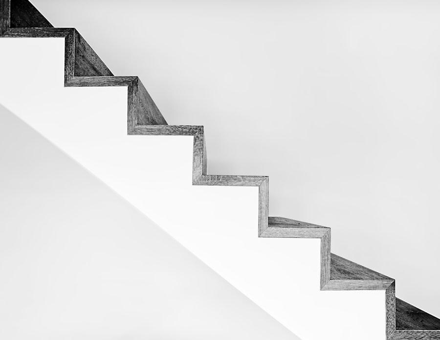 A flight of plain concrete stairs rising in even treads, a metaphor for a margin that repeats without drama